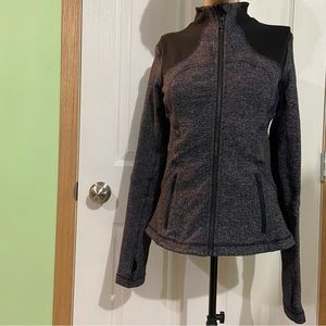 Lululemon women purple and black define fit active zip up top. Size 6. Used.
